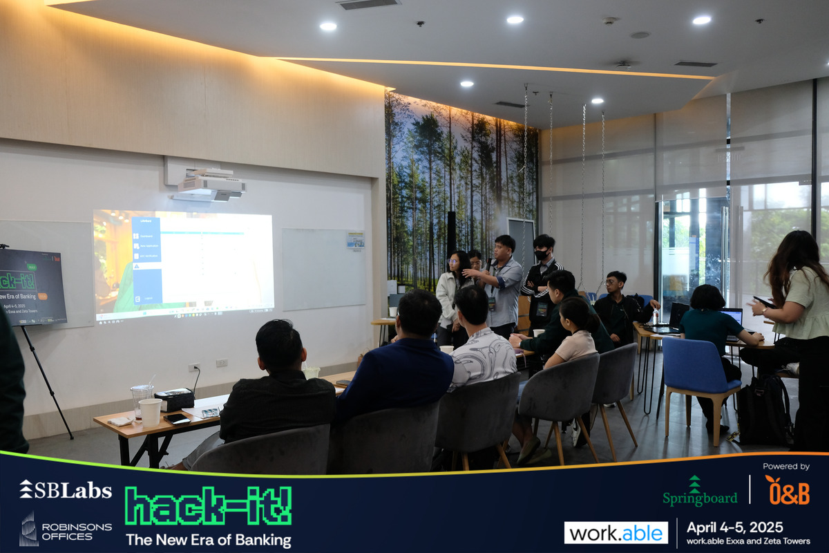 Participants engaging in discussion at hack-it! Hackathon.
